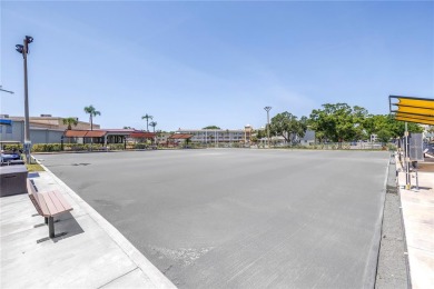 Live the easy life!!! PARKING SPACE DIRECTLY IN FRONT OF on On Top Of The World Golf Course in Florida - for sale on GolfHomes.com, golf home, golf lot
