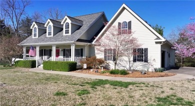 Step into serenity with this magnificent 4BD/3BA lake view on Holiday Island Executive Golf Course in Arkansas - for sale on GolfHomes.com, golf home, golf lot