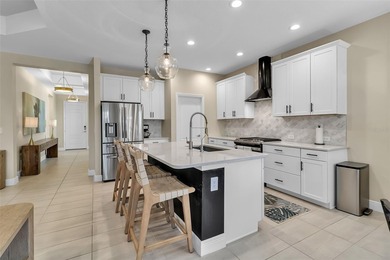 Pool home ~ nestled within the coveted Windward community in the on The Founders Golf Club in Florida - for sale on GolfHomes.com, golf home, golf lot