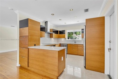 Set on a quiet, tree-lined street, this beautifully updated on Granada Golf Club in Florida - for sale on GolfHomes.com, golf home, golf lot