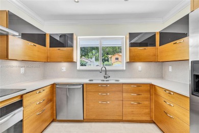 Set on a quiet, tree-lined street, this beautifully updated on Granada Golf Club in Florida - for sale on GolfHomes.com, golf home, golf lot