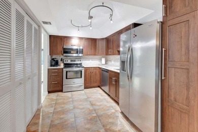 Enjoy the Florida lifestyle in this gorgeous 3rd-floor condo in on Boca Grove Golf and Tennis in Florida - for sale on GolfHomes.com, golf home, golf lot
