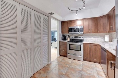 Enjoy the Florida lifestyle in this gorgeous 3rd-floor condo in on Boca Grove Golf and Tennis in Florida - for sale on GolfHomes.com, golf home, golf lot