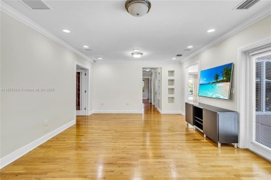 Set on a quiet, tree-lined street, this beautifully updated on Granada Golf Club in Florida - for sale on GolfHomes.com, golf home, golf lot
