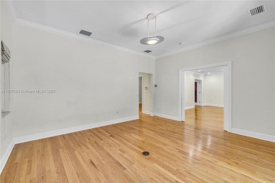 Set on a quiet, tree-lined street, this beautifully updated on Granada Golf Club in Florida - for sale on GolfHomes.com, golf home, golf lot