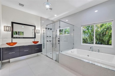 Set on a quiet, tree-lined street, this beautifully updated on Granada Golf Club in Florida - for sale on GolfHomes.com, golf home, golf lot