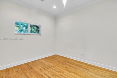 Set on a quiet, tree-lined street, this beautifully updated on Granada Golf Club in Florida - for sale on GolfHomes.com, golf home, golf lot