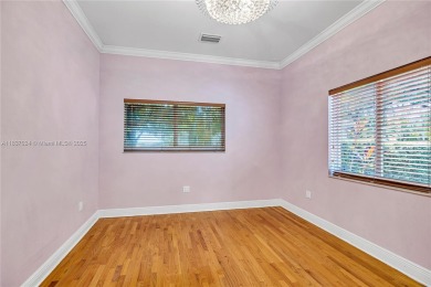 Set on a quiet, tree-lined street, this beautifully updated on Granada Golf Club in Florida - for sale on GolfHomes.com, golf home, golf lot