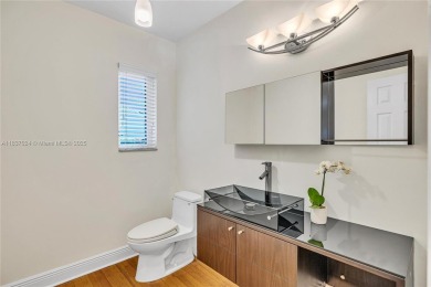 Set on a quiet, tree-lined street, this beautifully updated on Granada Golf Club in Florida - for sale on GolfHomes.com, golf home, golf lot