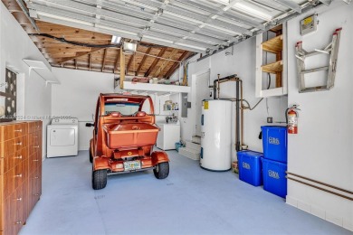 Set on a quiet, tree-lined street, this beautifully updated on Granada Golf Club in Florida - for sale on GolfHomes.com, golf home, golf lot