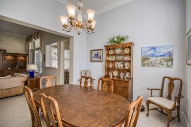 Expansive southern lake and golf views highlight this on Ironhorse Country Club in Florida - for sale on GolfHomes.com, golf home, golf lot