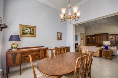 Expansive southern lake and golf views highlight this on Ironhorse Country Club in Florida - for sale on GolfHomes.com, golf home, golf lot