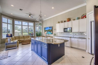 Expansive southern lake and golf views highlight this on Ironhorse Country Club in Florida - for sale on GolfHomes.com, golf home, golf lot