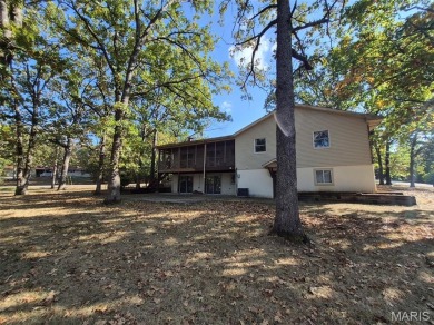 Take a look at this charming 3 bedroom 2 bath home in Terre Du on Terre Du Lac Golf and Country Club in Missouri - for sale on GolfHomes.com, golf home, golf lot