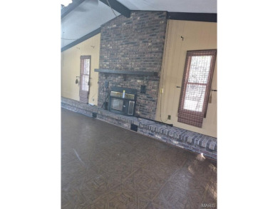 Take a look at this charming 3 bedroom 2 bath home in Terre Du on Terre Du Lac Golf and Country Club in Missouri - for sale on GolfHomes.com, golf home, golf lot