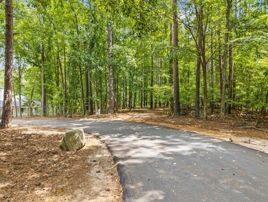 Located in the heart of the prestigious Great Waters community on Great Waters Course At Reynolds Plantation in Georgia - for sale on GolfHomes.com, golf home, golf lot