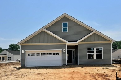 Live the low-maintenance lifestyle in the popular Gwinnett B on Players Course At Wyboo Plantation in South Carolina - for sale on GolfHomes.com, golf home, golf lot