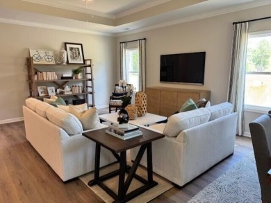 Live the low-maintenance lifestyle in the popular Gwinnett B on Players Course At Wyboo Plantation in South Carolina - for sale on GolfHomes.com, golf home, golf lot