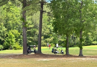 Live the low-maintenance lifestyle in the popular Gwinnett B on Players Course At Wyboo Plantation in South Carolina - for sale on GolfHomes.com, golf home, golf lot