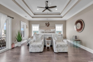 This home is coastal living at his finest. Rising majestically on Myrtlewood Golf Course and Club  in South Carolina - for sale on GolfHomes.com, golf home, golf lot