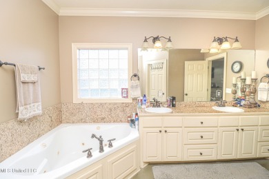 This beautiful 3-bedroom, 2-bathroom split plan home with an on Patrick Farms Golf Club in Mississippi - for sale on GolfHomes.com, golf home, golf lot