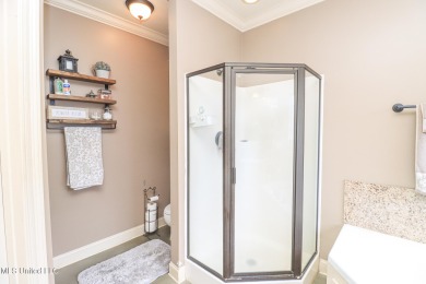 This beautiful 3-bedroom, 2-bathroom split plan home with an on Patrick Farms Golf Club in Mississippi - for sale on GolfHomes.com, golf home, golf lot