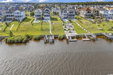 This home is coastal living at his finest. Rising majestically on Myrtlewood Golf Course and Club  in South Carolina - for sale on GolfHomes.com, golf home, golf lot