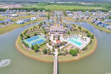 This home is coastal living at his finest. Rising majestically on Myrtlewood Golf Course and Club  in South Carolina - for sale on GolfHomes.com, golf home, golf lot