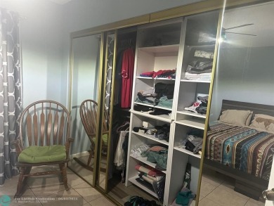 This condo has it all- tile throughout- new appliances - newer on Hillsboro Pines Golf in Florida - for sale on GolfHomes.com, golf home, golf lot