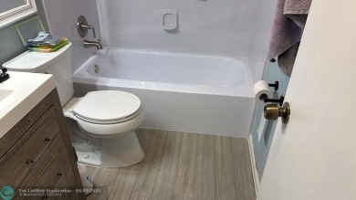 This condo has it all- tile throughout- new appliances - newer on Hillsboro Pines Golf in Florida - for sale on GolfHomes.com, golf home, golf lot