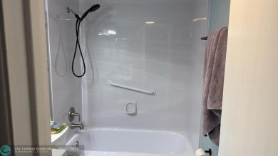 This condo has it all- tile throughout- new appliances - newer on Hillsboro Pines Golf in Florida - for sale on GolfHomes.com, golf home, golf lot
