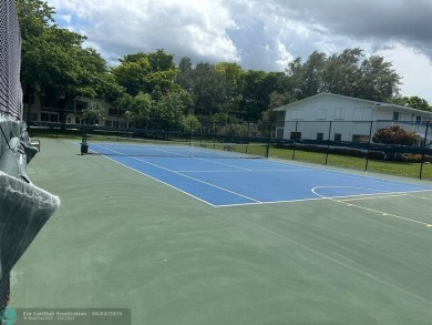 This condo has it all- tile throughout- new appliances - newer on Hillsboro Pines Golf in Florida - for sale on GolfHomes.com, golf home, golf lot
