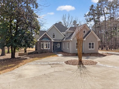 LAKE VIEWS AND A PREMIER GREAT WATERS LOCATION PRESENT AN on Great Waters Course At Reynolds Plantation in Georgia - for sale on GolfHomes.com, golf home, golf lot