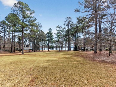 LAKE VIEWS AND A PREMIER GREAT WATERS LOCATION PRESENT AN on Great Waters Course At Reynolds Plantation in Georgia - for sale on GolfHomes.com, golf home, golf lot