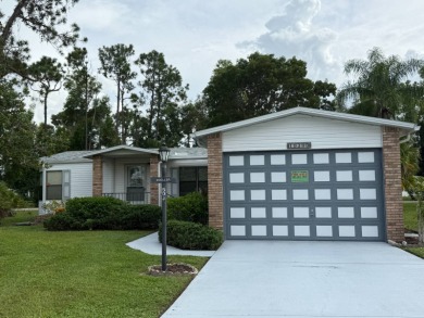 This lovely, manufactured home on leased land in a gated and age on Pine Lakes Country Club in Florida - for sale on GolfHomes.com, golf home, golf lot
