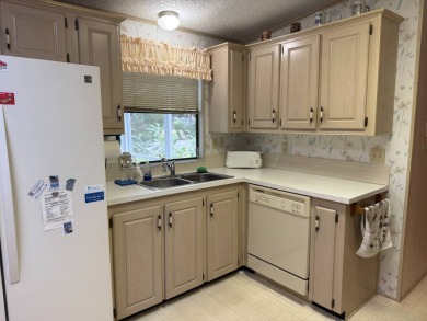 This lovely, manufactured home on leased land in a gated and age on Pine Lakes Country Club in Florida - for sale on GolfHomes.com, golf home, golf lot