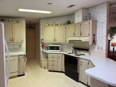 This lovely, manufactured home on leased land in a gated and age on Pine Lakes Country Club in Florida - for sale on GolfHomes.com, golf home, golf lot