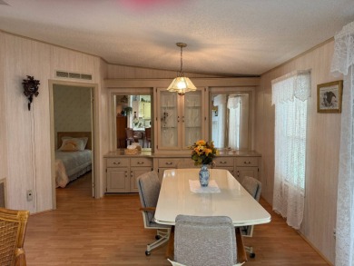 This lovely, manufactured home on leased land in a gated and age on Pine Lakes Country Club in Florida - for sale on GolfHomes.com, golf home, golf lot