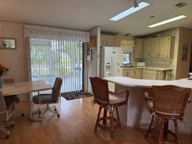 This lovely, manufactured home on leased land in a gated and age on Pine Lakes Country Club in Florida - for sale on GolfHomes.com, golf home, golf lot