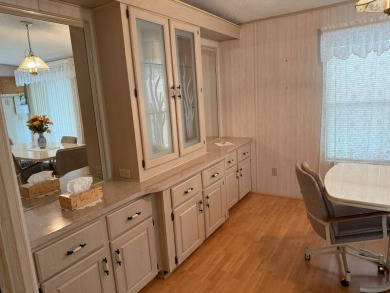 This lovely, manufactured home on leased land in a gated and age on Pine Lakes Country Club in Florida - for sale on GolfHomes.com, golf home, golf lot