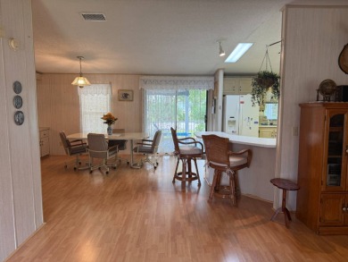 This lovely, manufactured home on leased land in a gated and age on Pine Lakes Country Club in Florida - for sale on GolfHomes.com, golf home, golf lot