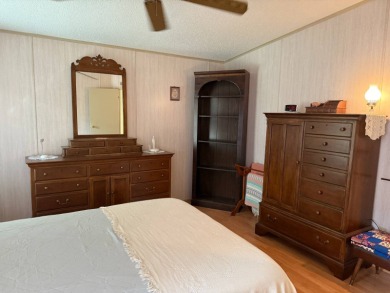 This lovely, manufactured home on leased land in a gated and age on Pine Lakes Country Club in Florida - for sale on GolfHomes.com, golf home, golf lot