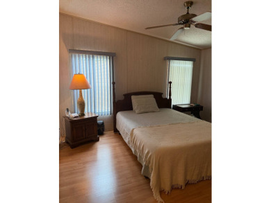 This lovely, manufactured home on leased land in a gated and age on Pine Lakes Country Club in Florida - for sale on GolfHomes.com, golf home, golf lot