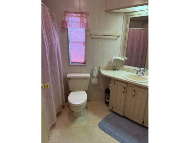 This lovely, manufactured home on leased land in a gated and age on Pine Lakes Country Club in Florida - for sale on GolfHomes.com, golf home, golf lot