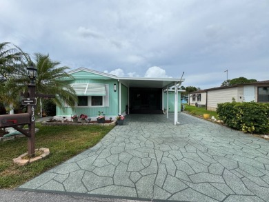 This immaculate, well-maintained 2 bedroom/2 bath manufactured on Lake Henry Golf Club in Florida - for sale on GolfHomes.com, golf home, golf lot