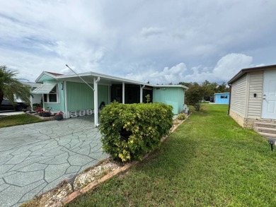 This immaculate, well-maintained 2 bedroom/2 bath manufactured on Lake Henry Golf Club in Florida - for sale on GolfHomes.com, golf home, golf lot