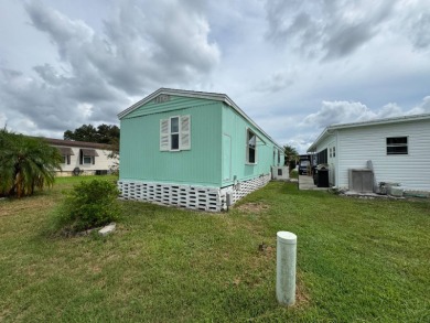 This immaculate, well-maintained 2 bedroom/2 bath manufactured on Lake Henry Golf Club in Florida - for sale on GolfHomes.com, golf home, golf lot