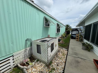 This immaculate, well-maintained 2 bedroom/2 bath manufactured on Lake Henry Golf Club in Florida - for sale on GolfHomes.com, golf home, golf lot