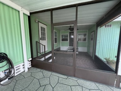 This immaculate, well-maintained 2 bedroom/2 bath manufactured on Lake Henry Golf Club in Florida - for sale on GolfHomes.com, golf home, golf lot