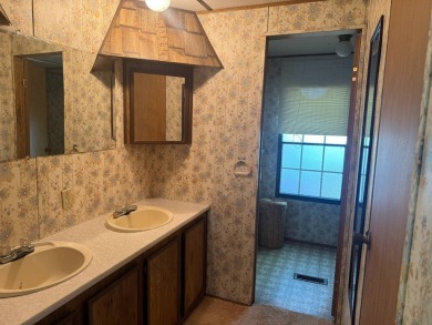 This tree shaded lakeside property has great potential.  With on Lake Bruin Golf and Country Club in Louisiana - for sale on GolfHomes.com, golf home, golf lot